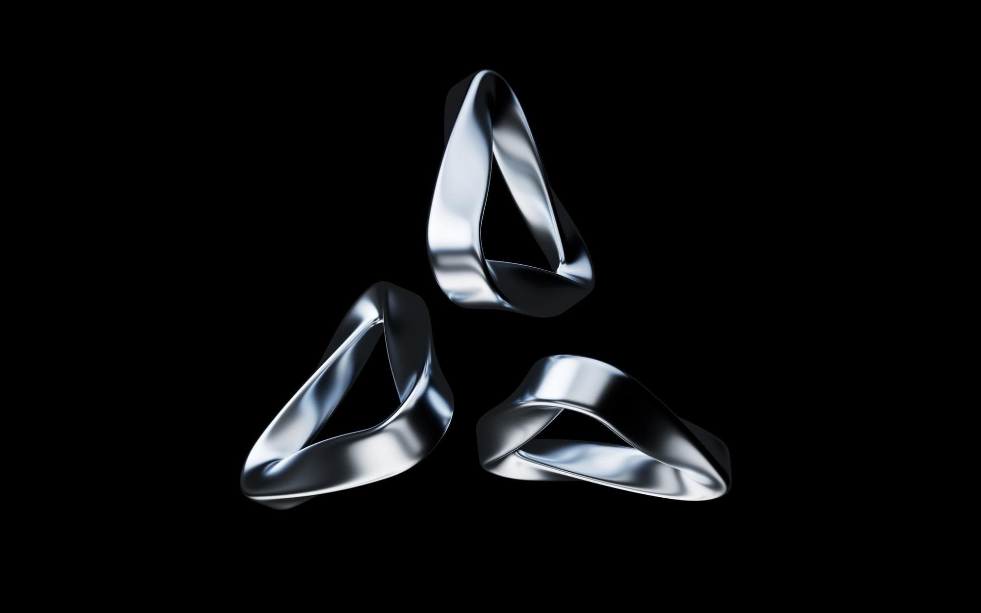 Three chrome triangles representing converging technology pillars
